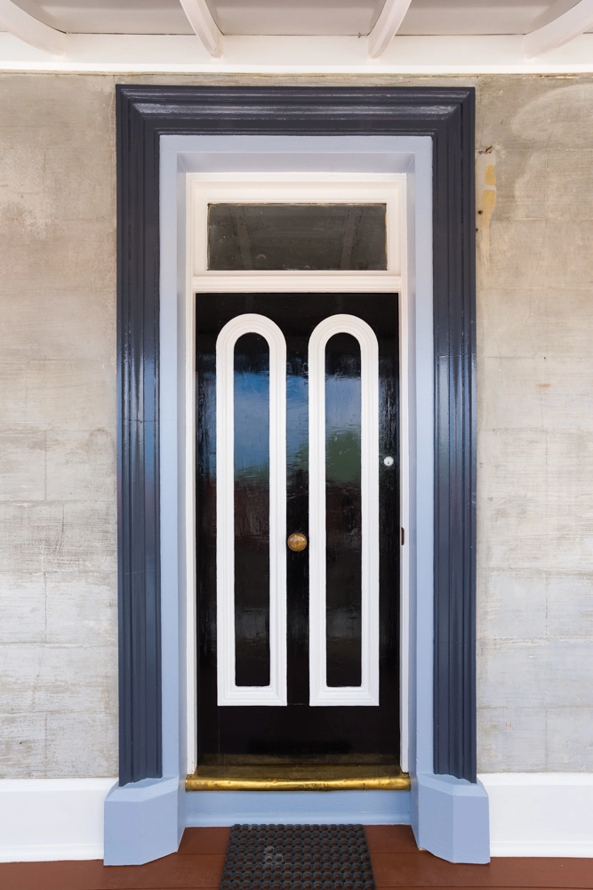 Black and white entry door painted